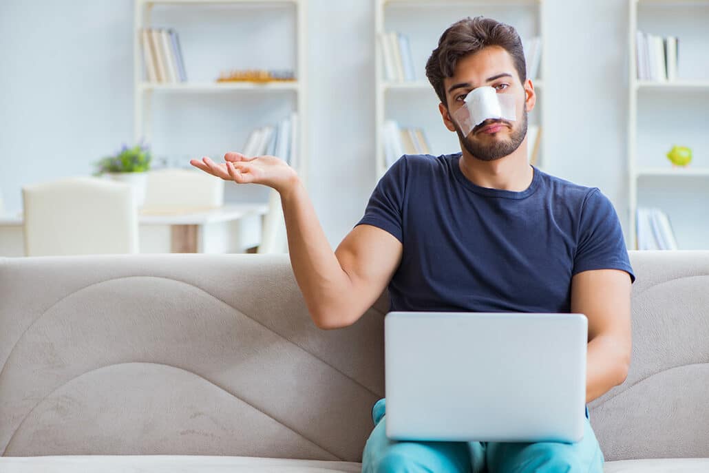 Male rhinoplasty patient waiting for his nose procedure to fully heal.