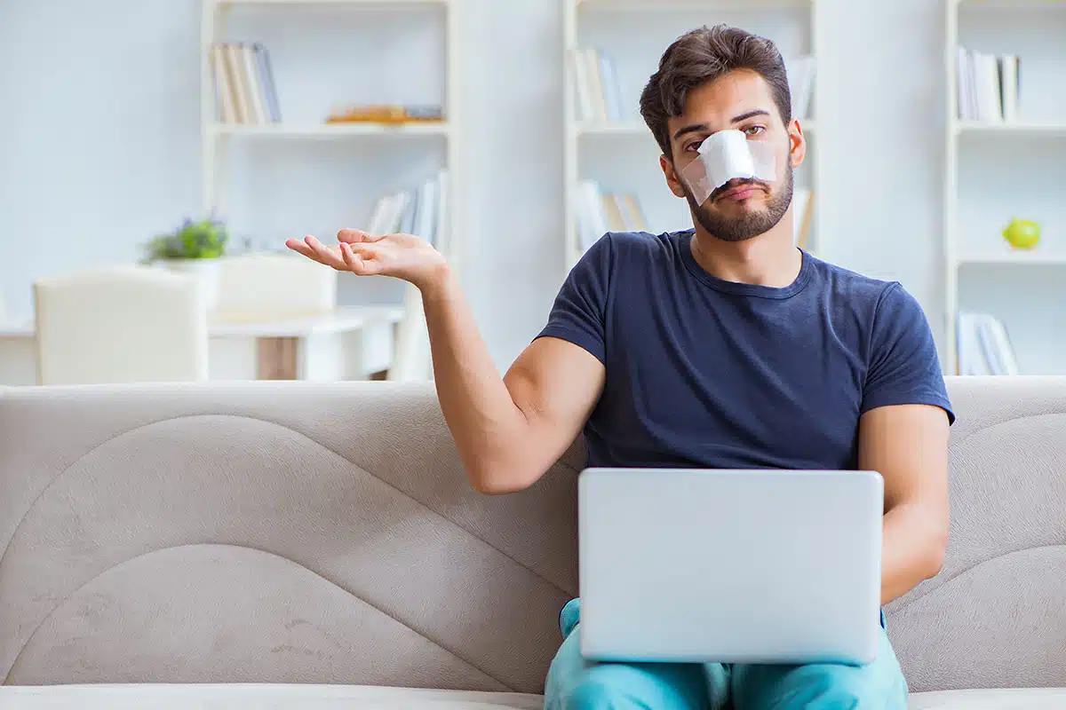 Male rhinoplasty patient waiting for his nose procedure to fully heal.