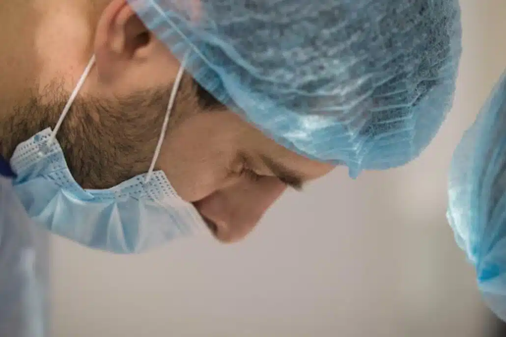 Rhinoplasty expert in the middle of a nasal plastic surgery using septal cartilage and lateral cartilage.